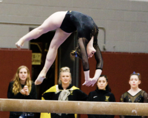 Gustavus Adolphus gymnast on beam