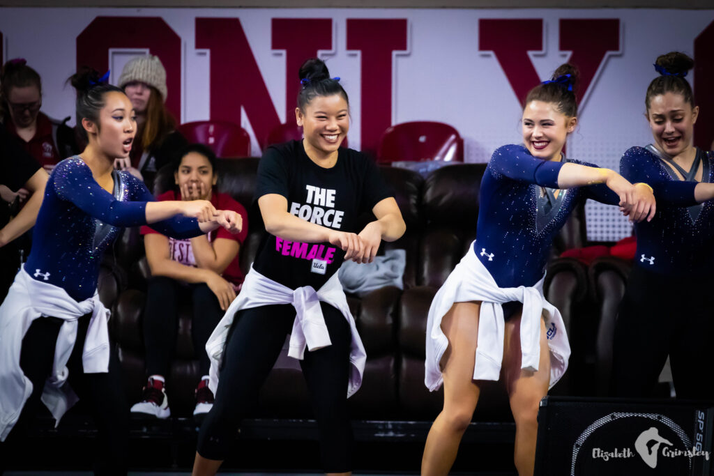 Brielle Nguyen, Anna Glenn, Macy Toronjo, and Kendal Poston have a dance party on the sidelines of the 2019 match-up between UCLA and Oklahoma