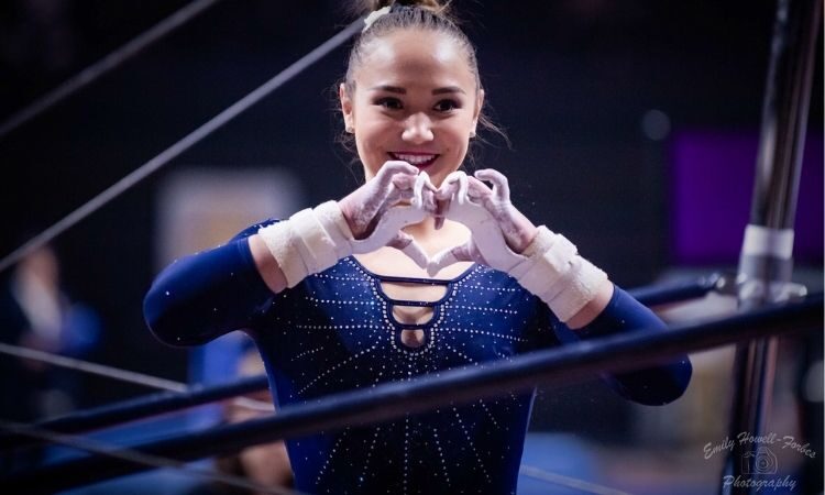 Kalyany Steele makes a heart with her hands at UCLA's meet against Oregon State in 2020