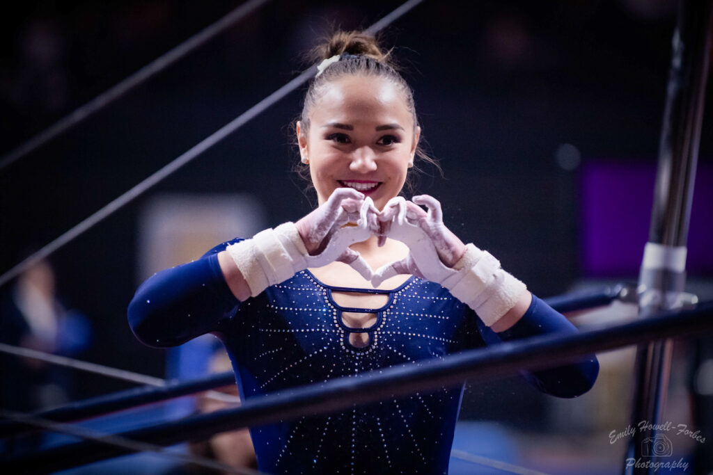 Kalyany Steele makes a heart with her hands at the UCLA/Oregon State meet in 2020