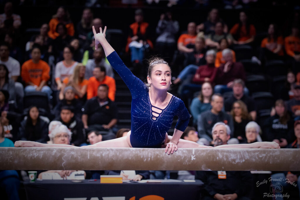 Norah Flatley mounts the beam for her routine against Oregon State in 2020