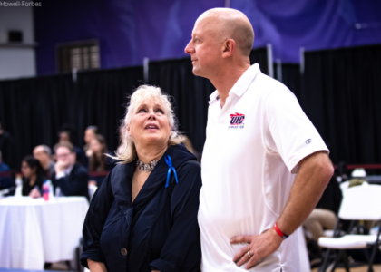 Mary Jansson looks up at Peter Jansson in UIC's last meet in 2019.