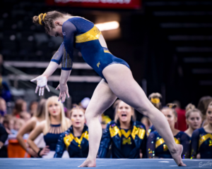 Natalie Wojcik competes on the floor for Michigan.