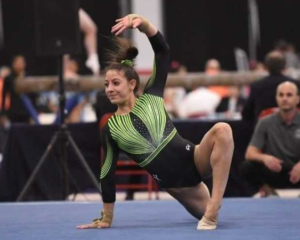 Danielle Ferris poses near the floor during her routine