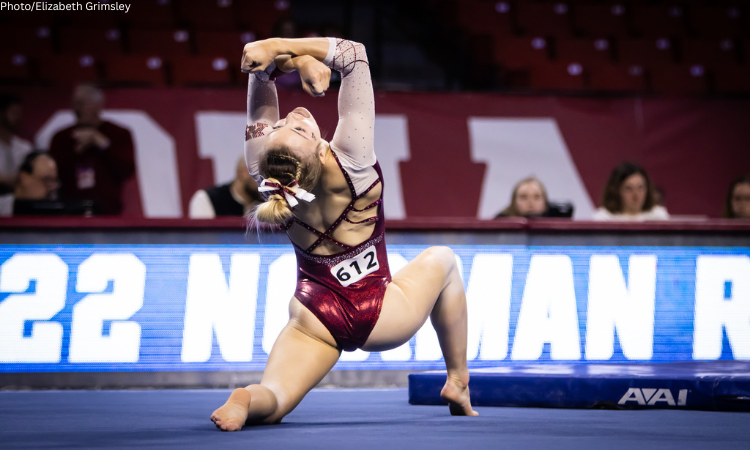 Halle Remlinger does a pose on the floor during her routine