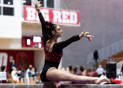 Victoria DeMeo of Cornell does a pose on the beam during her routine