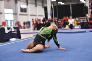 Sydney Seabrooks does a pose on floor during her routine