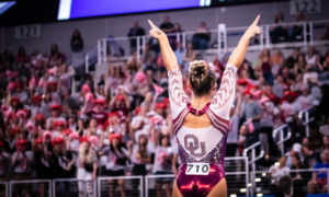 Ragam Smith points to the Oklahoma fans in the stands after her floor routine