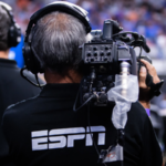 An ESPN cameraman works at the 2022 NCAA National Championship.