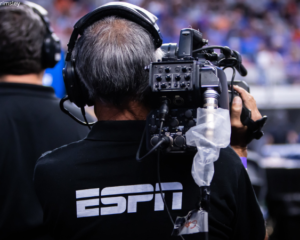 An ESPN cameraman works at the 2022 NCAA National Championship.