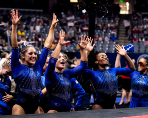 Kentucky gymnasts cheer for their teammate after a routine