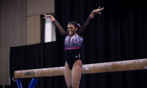 Lynnzee Brown salutes after her beam routine