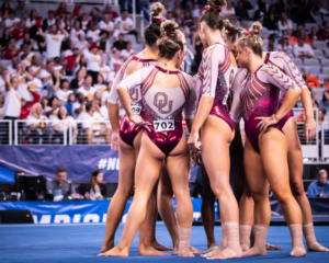 The Oklahoma floor lineup huddles before the start of the rotation