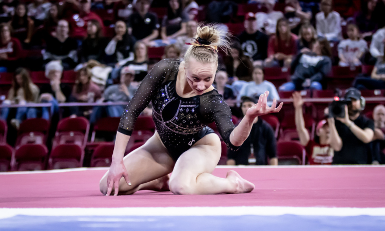 Jessica Hutchinson does on-the-floor choreography during her floor routine