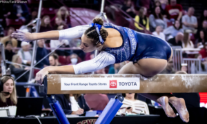 Amani Herring competes on beam for Penn State.