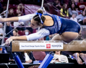 Amani Herring competes on beam for Penn State.