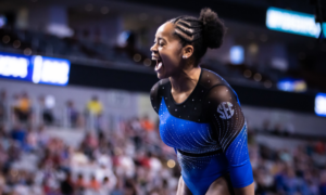 Sloane Blakely celebrates after her beam routine