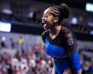Sloane Blakely celebrates after her beam routine