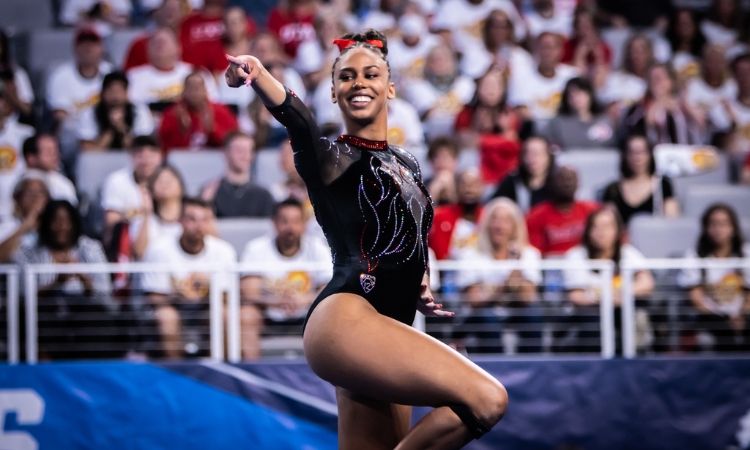 Jaedyn Rucker points to the crowd during choreography for her floor routine