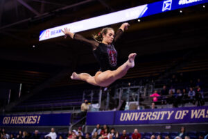 Chloe Widner hits an oversplit on a leap on beam