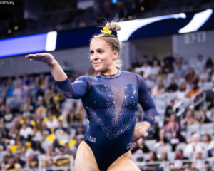 Abby Heiskell competes on floor for Michigan.