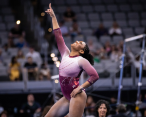 Lynnzee Brown points to the sky at the end of her floor routine