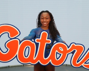 Maddy Dorbin poses with a Gator sign