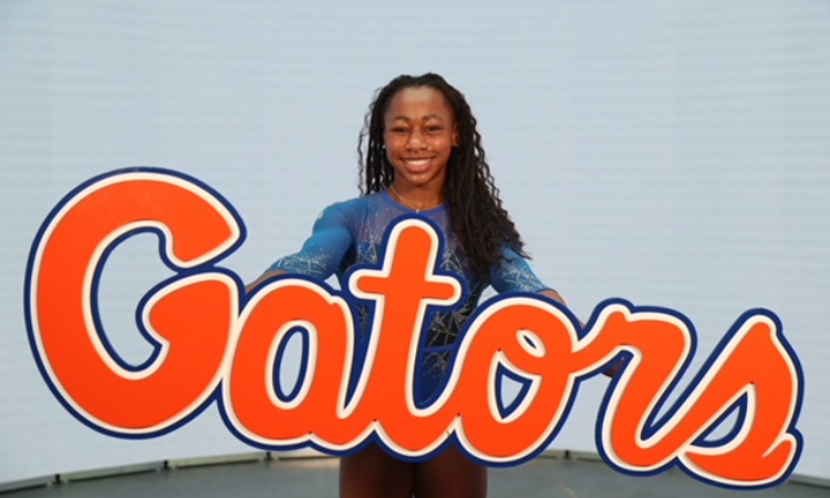 Maddy Dorbin poses with a Gator sign