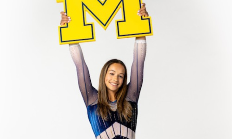 Sophia Diaz holds up a Michigan M
