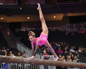 Quin Kuhl competes on beam at the Nastia Liukin Cup