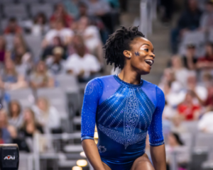 Arianna Patterson smiling near beam