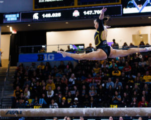 Adeline Kenlin competes on beam for Iowa.