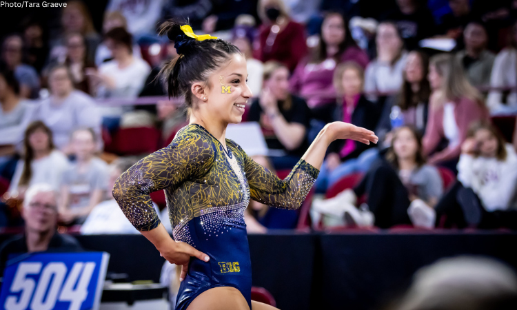 Reyna Guggino competes on floor for Michigan.