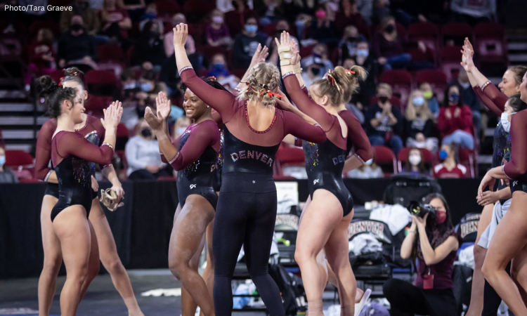 Denver gymnasts celebrate and cheer