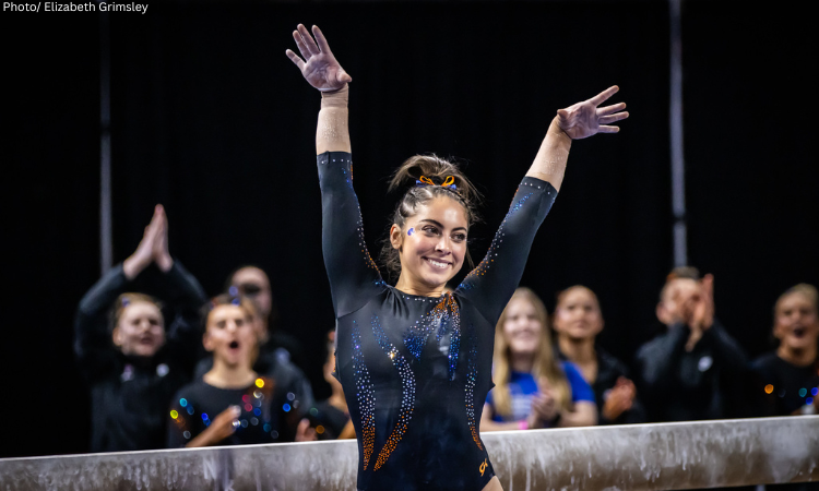 Emily Lopez salutes after a beam routine for Boise State.