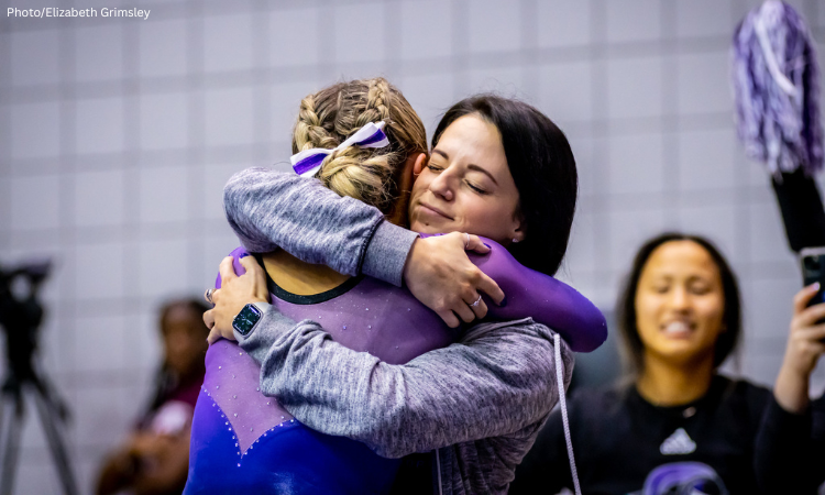 Lorraine Galow, Bridgeport hugs a gymnast