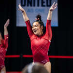 Kalyxta Gamiao Arkansas salutes after her routine