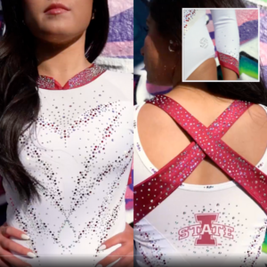 A split image showing the front and back of a white leotard with red and silver accents. The front features a deep V-neckline with red trim and scattered silver and red rhinestones arranged in a V-shaped pattern. The back has a criss-cross design made of wide red ribbons with silver rhinestones, and the Iowa State logo in red at the lower back. A smaller inset image shows a close-up of a white arm sleeve with red trim and scattered rhinestones.