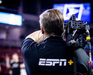 broadcaster holding camera