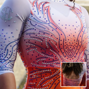 A striking white-to-orange gradient leotard adorned with intricate swirling rhinestone patterns mimicking flames. The SEC logo is displayed on the sleeve, and the open-back design adds a bold touch. The embellishments create a dazzling effect, reflecting Auburn's dynamic energy.