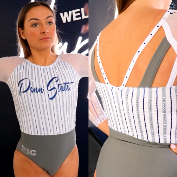 A gymnast from Penn State wearing a white and gray leotard with a baseball-inspired pinstripe design. "Penn State" is written in blue script, with silver crystals outlining the stripes. The back has thin white straps forming a geometric pattern, complementing the sporty theme. The sleeves are sheer, with crystal detailing around the upper arms, and the bottom half is solid gray.