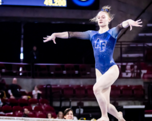 Air Force's Maggie Slife poses on beam.