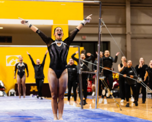 Gianna Masella salutes after her uneven bars routine.
