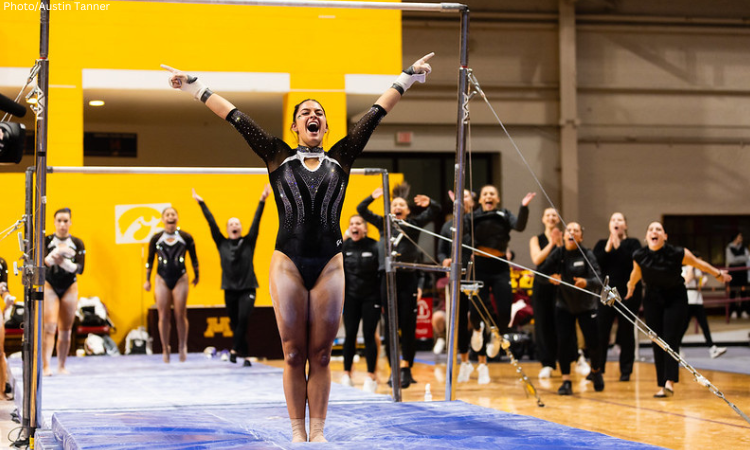 Gianna Masella salutes after her uneven bars routine.