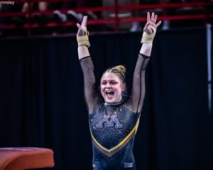 Sarah Moraw salutes with a smile after her vault.