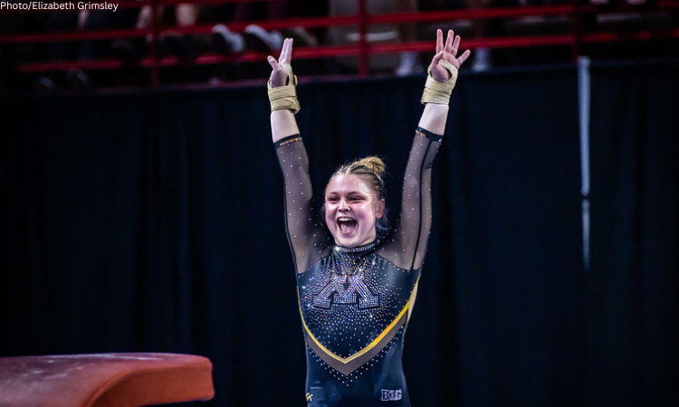 Sarah Moraw salutes with a smile after her vault.