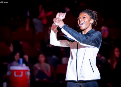 Lynnzee Brown raises her hands and crosses them.