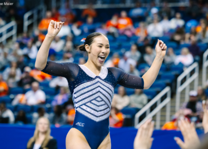 Madelyn Williams cheers with hands up