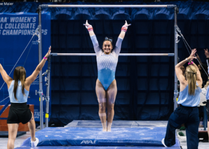 Lali Dekanoidze saluting after her bar routine