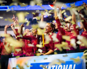Oklahoma celebrating its national title with the trophy and confetti falling down